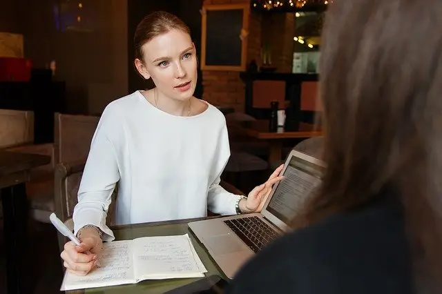 Woman Working and talking with another woman